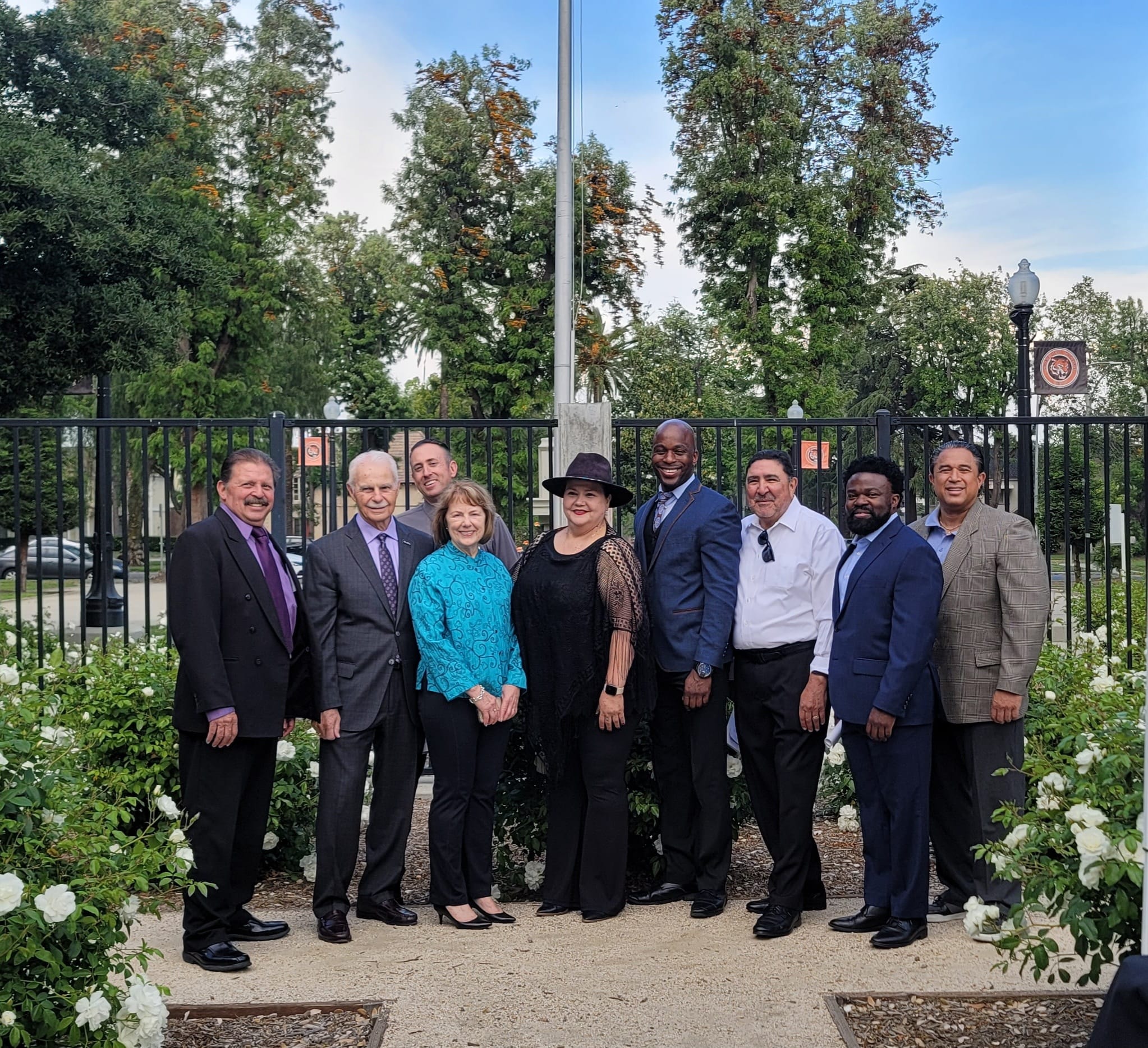 D'Andre Lampkin with Esperanza Scholarship Foundation board members in rose garden