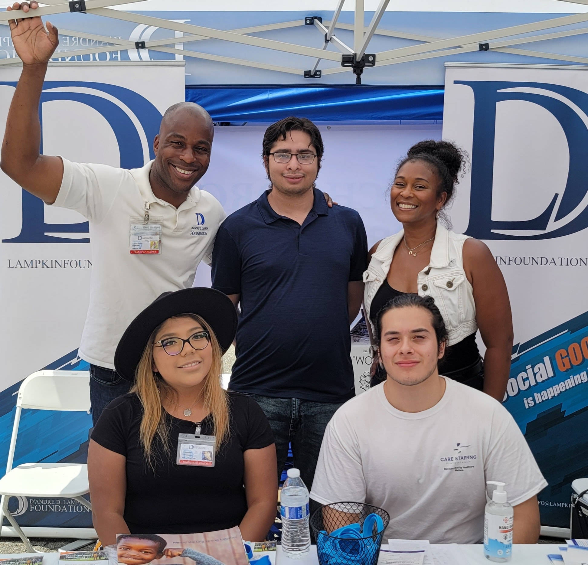 D'Andre Lampkin and Lampkin Foundation team at outdoor community outreach booth