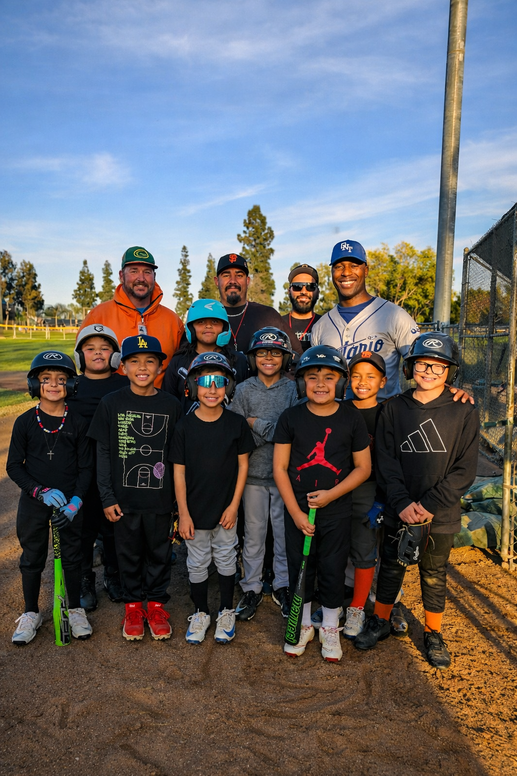 D'Andre Lampkin with Ontario Mountain View AAA Baseball team and youth players
